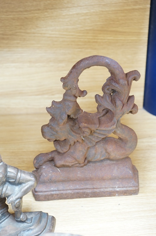 A 19th century cast iron ‘Punch’ door stop and three others, tallest 31cm. Condition - fair to good